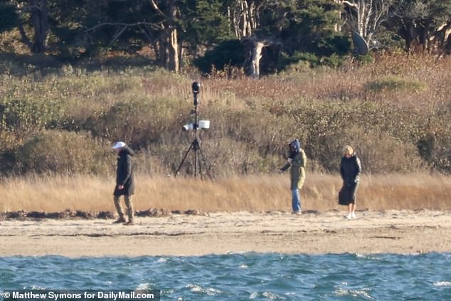 First Lady Jill Biden and daughter Ashley take an afternoon walk and pick up some seashells along a private beach attached to the home on Nantucket where the Bidens spend their Thanksgiving holidays