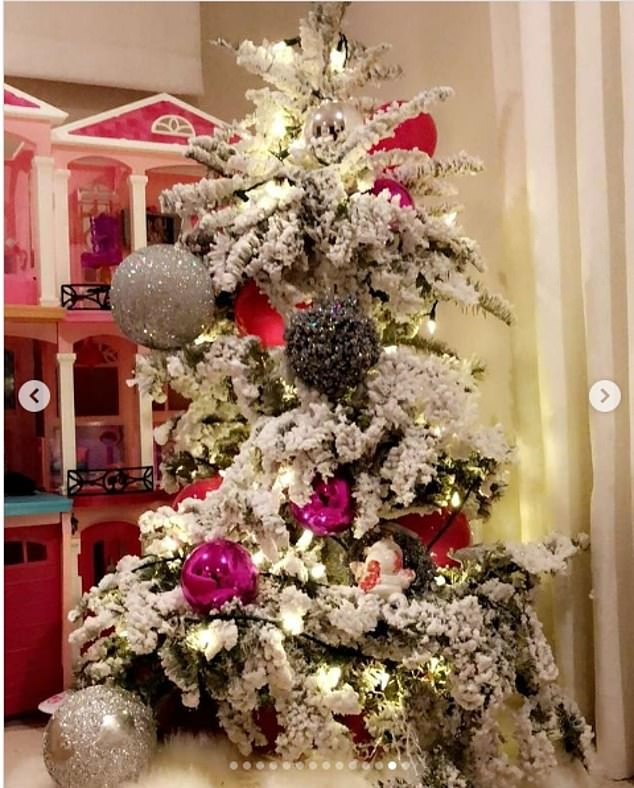 The star showed off a mini tree with large ornaments