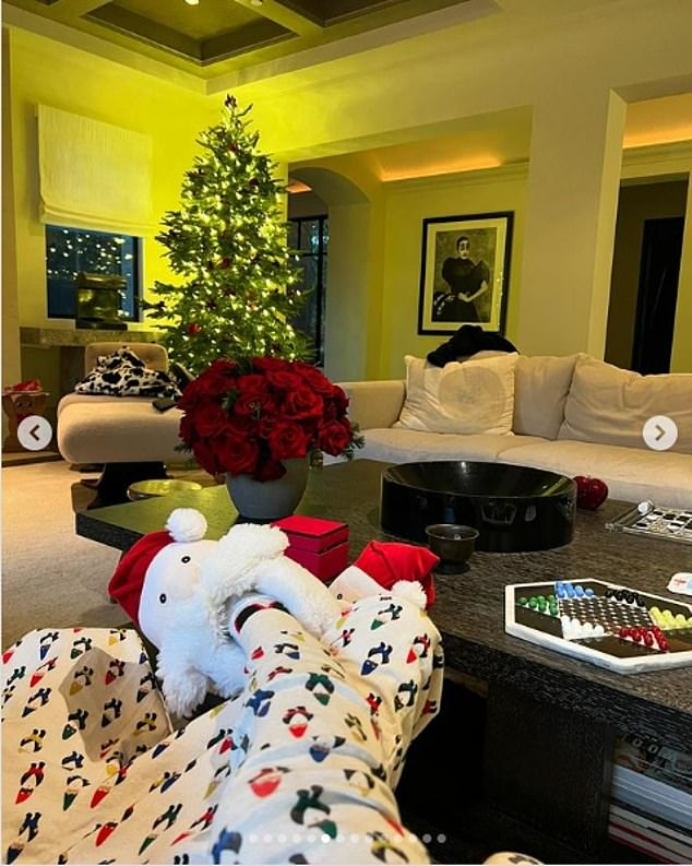 Kourtney also showed off her Santa slip-on shoes