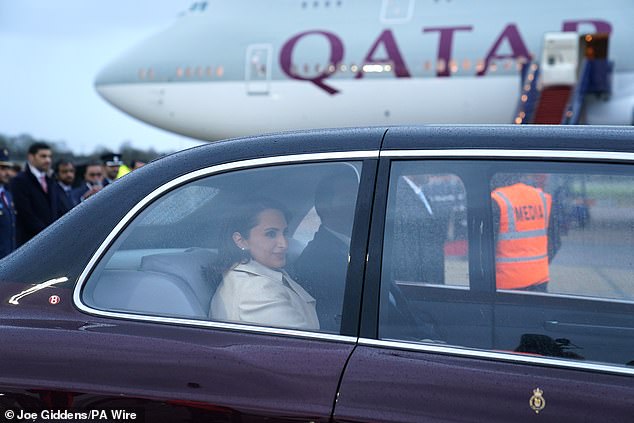 The Emir of Qatar and his wife are driven away from Stansted Airport this afternoon