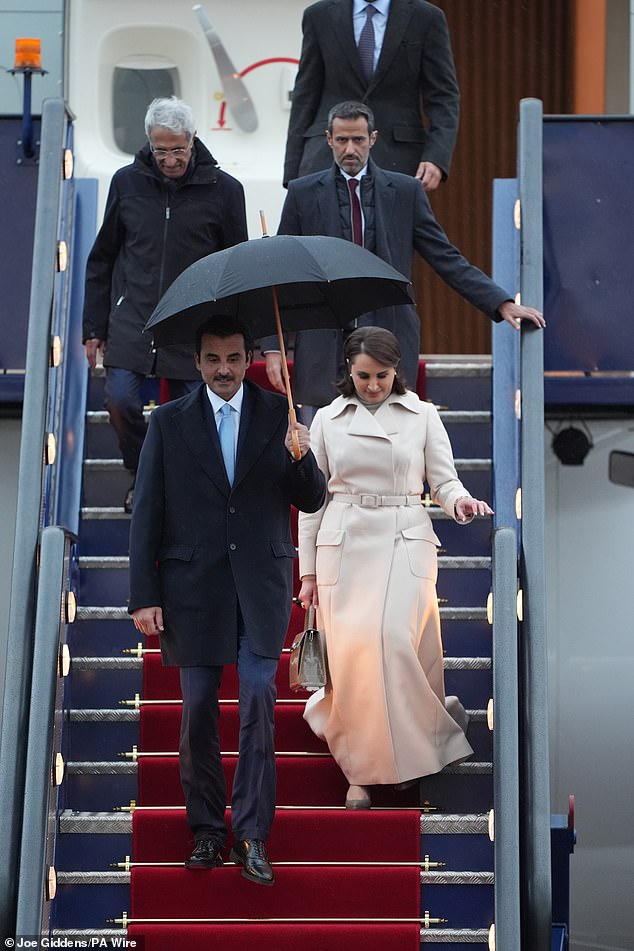 The Emir of Qatar and his wife arrive at Stansted Airport in Essex today for the state visit