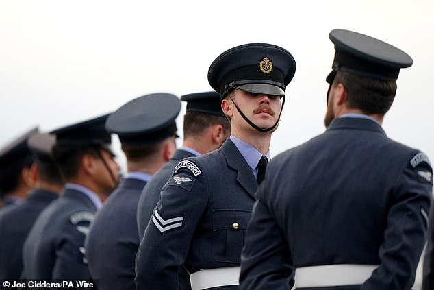 Members of the RAF await the arrival of the Emir of Qatar at Stansted Airport today