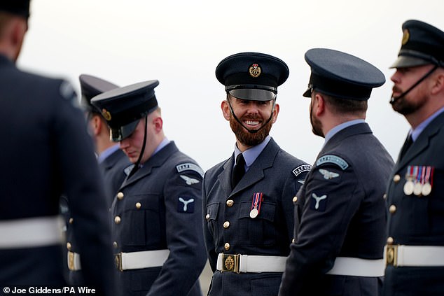 Members of the RAF await the arrival of the Emir of Qatar at Stansted Airport today