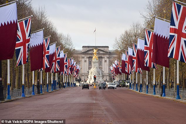 Flags line The Mall leading to Buckingham Palace today ahead of the Emir of Qatar's visit