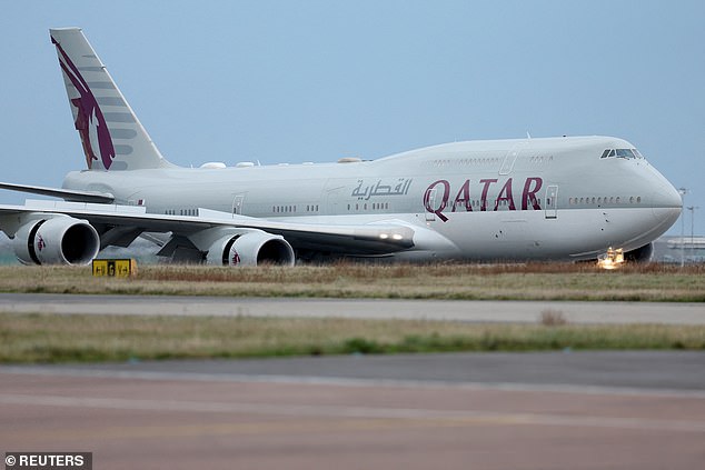 The plane carrying the Emir of Qatar arrives at Stansted Airport in Essex today