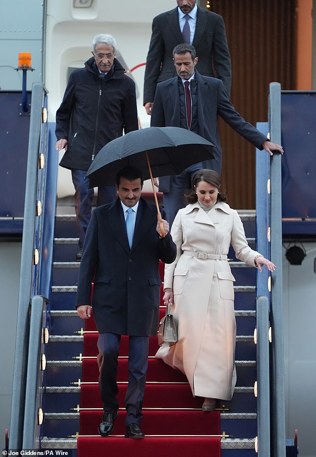 The Emir of Qatar and his wife arrive at Stansted Airport in Essex today for the state visit