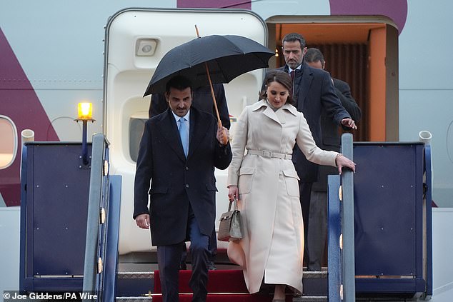 The Emir of Qatar and his wife arrive at Stansted Airport in Essex today for the state visit