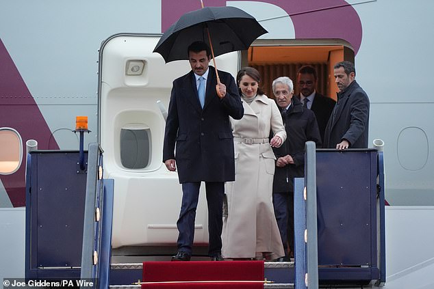 The Emir of Qatar and his wife arrive at Stansted Airport in Essex today for the state visit