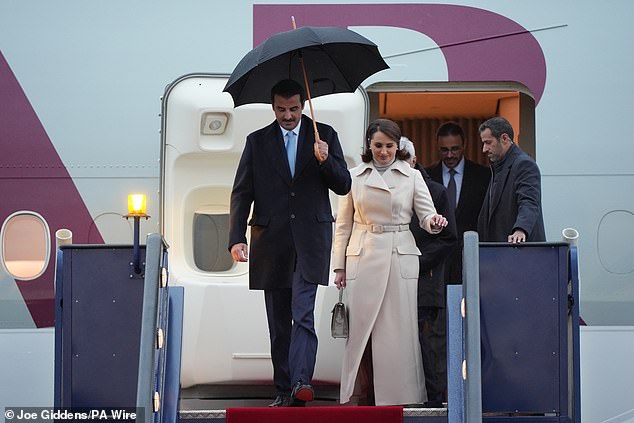 The Emir of Qatar and his wife arrive at Stansted Airport in Essex today for the state visit