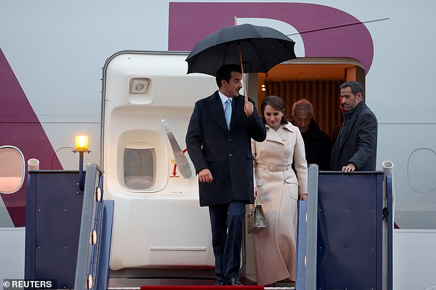 The Emir of Qatar and his wife arrive at Stansted Airport in Essex today for the state visit