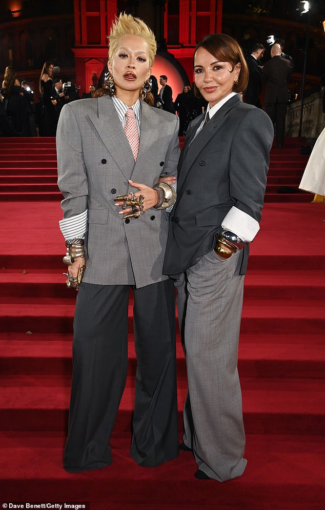 She was joined by her mother Vera, who complemented her daughter by wearing a matching suit, with her blazer and trousers the opposite shades to Rita's