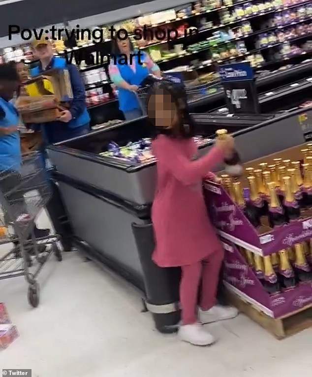 The child started grabbing and chucking glass bottles of sparkling juice on the floor before a man intervened