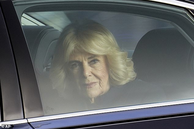 Camilla is driven around the quadrangle to the Buckingham Palace Grand Entrance today