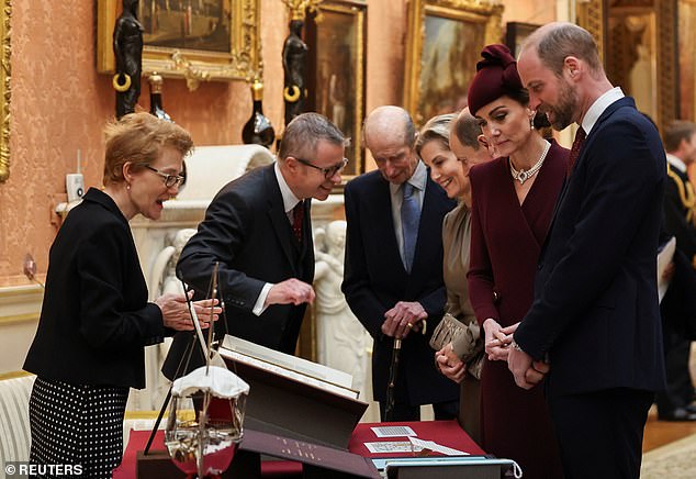 The royals view a display of Qatari items from the Royal Collection at Buckingham Palace today