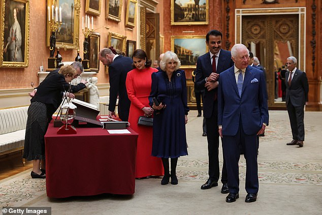 The royals view a display of Qatari items from the Royal Collection at Buckingham Palace today