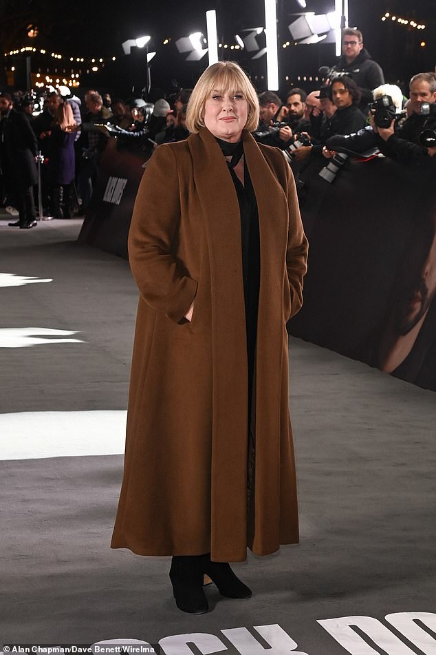 Happy Valley ¿s Sarah Lancashire, 60, also walked the carpet in a long brown coat and heeled boots as she showed off her new bob hairstyle