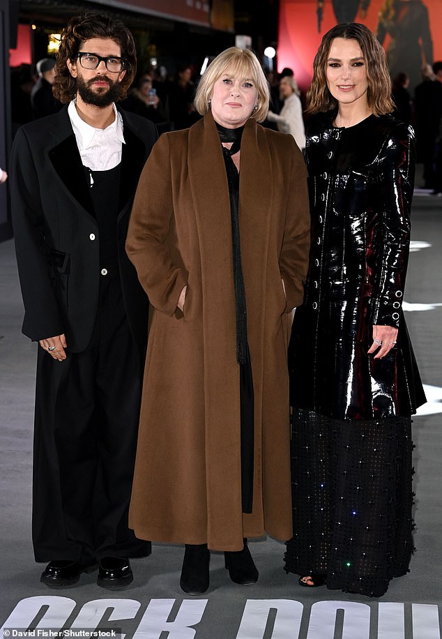 Ben, Sarah, and Keira posed together on the carpet