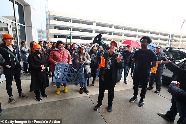 Pictured: Protesters with People's Action target health insurance giant UnitedHealth Group due to exorbitant health insurance costs and insurance claims denials on April 16, 2024