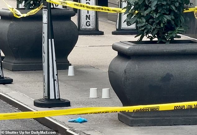 Shell casings covered by cups at the scene of the tragedy