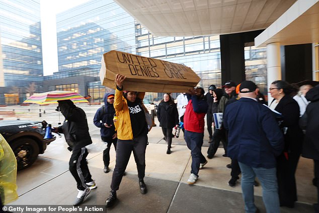 Pictured: Protesters with People's Action target health insurance giant UnitedHealth Group due to exorbitant health insurance costs and insurance claims denials on April 16, 2024 in Eden Prairie, Minnesota