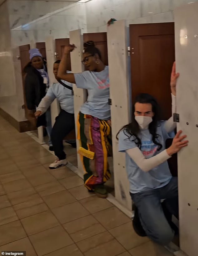 The group of protesters - including trans actress James Rose (right) - danced to Meeting in the Ladies room by Klymaxx