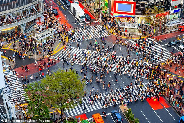 Shibuya Crossing halts all cars every 80 seconds, when up to 3,000 people wait for the lights to turn green before scrambling in all directions across five crosswalks