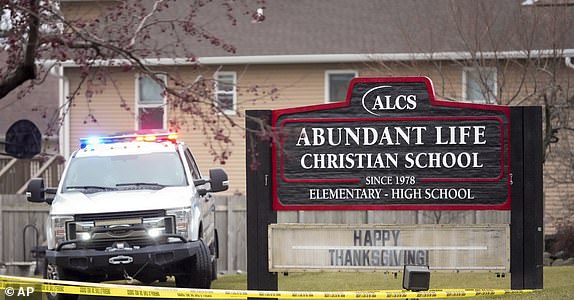 Emergency vehicles are parked outside the Abundant Life Christian School in Madison, Wis., following a shooting, Monday, Dec. 16, 2024. (AP Photo/Morry Gash)