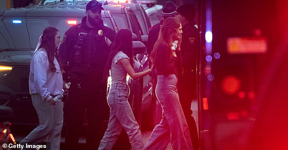 MADISON, WISCONSIN - DECEMBER 16: Students are escorted from a church next to the Abundant Life Christian School on December 16, 2024 in Madison, Wisconsin. A student and teacher were shot and killed and the alleged shooter, who police say they believe to have been a student at the school, was found dead at the scene, according to published reports. Six others were injured with two in critical condition, the reports said.  (Photo by Scott Olson/Getty Images)