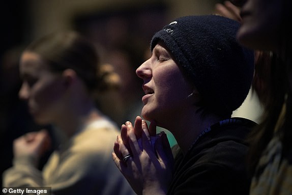 MIDDLETON, WISCONSIN - DECEMBER 16: People attend a prayer service at Blackhawk Church to mourn the victims of Abundant Life Christian School on December 16, 2024 in Middleton, Wisconsin. A student and teacher were shot and killed and the alleged shooter, a 15-year-old female who police say was a student at the school, was found dead at the scene, according to published reports. Six others were injured with two in critical condition, the reports said.  (Photo by Scott Olson/Getty Images)