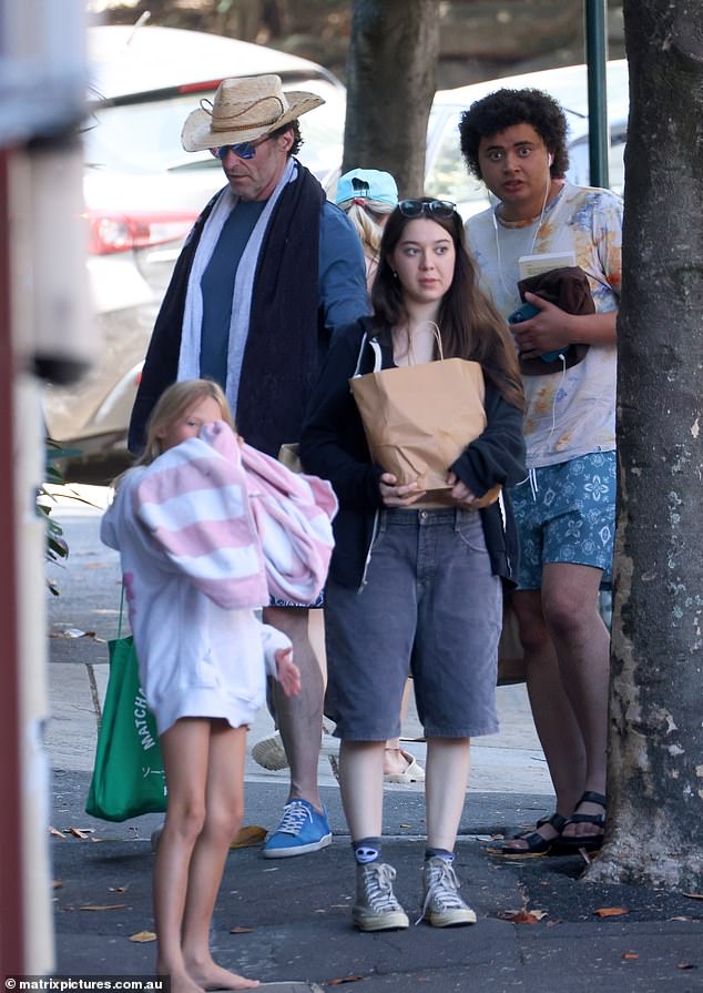 He was joined by his son Oscar and daughter Ava and his personal trainer. All pictured