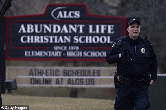 MADISON, WISCONSIN - DECEMBER 16: A police officer stands guard in front of Abundant Life Christian School on December 16, 2024 in Madison, Wisconsin. According to reports, a student and teacher were shot and killed at the school earlier today, and the suspected shooter was found dead at the scene. (Photo by Scott Olson/Getty Images)