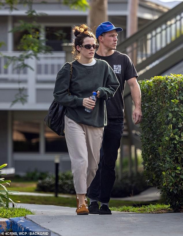 The granddaughter of Elvis Presley, 34, opted for a green oversized sweater and cropped beige trousers for the outing