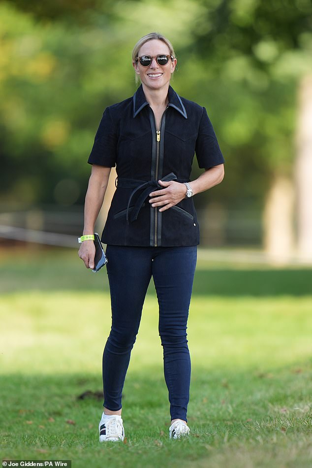 At the Blenheim Palace Horse Trials in September, Zara chose Fairfax & Favor's 'Gina' top, crafted from luxurious navy suede with leather trims, paired effortlessly with classic skinny jeans