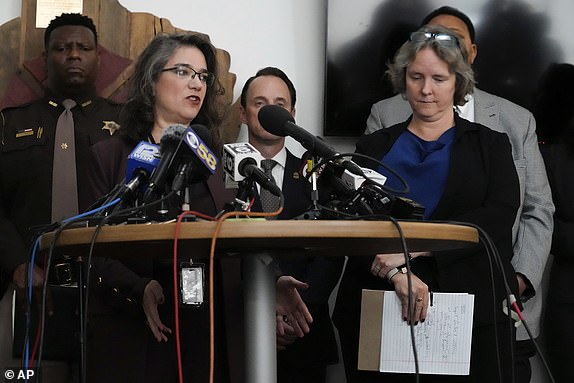 Dane County executive Melissa Agard, left, speaks as Madison Mayor Satya Rhodes-Conway, right, listens at a news conference Tuesday, Dec. 17, 2024, in Madison, Wis., following a shooting at the Abundant Life Christian School on Monday. (AP Photo/Nam Y. Huh)