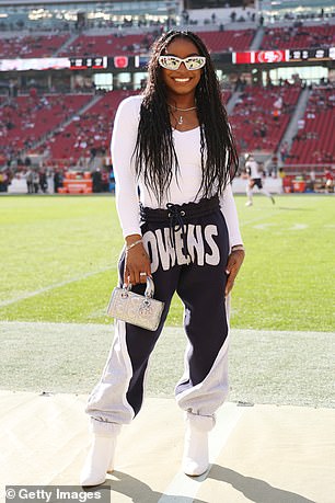 Biles is pictured on the sidelines of a Chicago Bears game to cheer on her husband