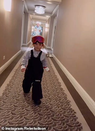 A sweet video shows the little one barreling down the hall as they head for a family ski lesson