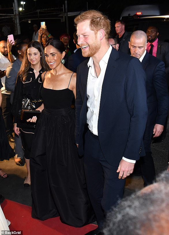 The Duchess of Sussex , 42, oozed glamour in the monochrome ensemble, which she looked to team with a simple body suit, on Tuesday evening