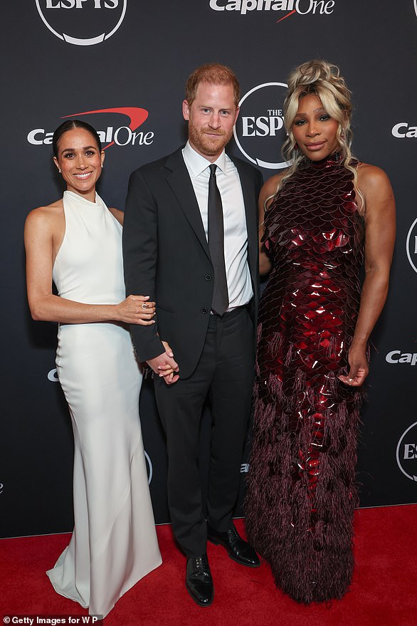 Prince Harry and Meghan, wearing a custom Oscar de la Renta gown, pictured at the ESPY awards with tennis superstar Serena Williams on July 11