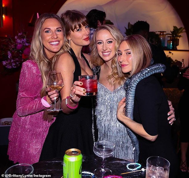 Joining the WAGs was Swift's longtime friend Ashley Avignone (right)