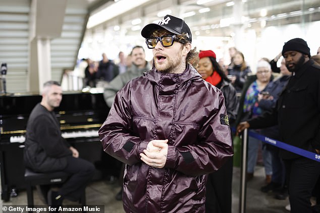 To complete his look, he opted for a pair of yellow-tinted shades and donned a black baseball cap