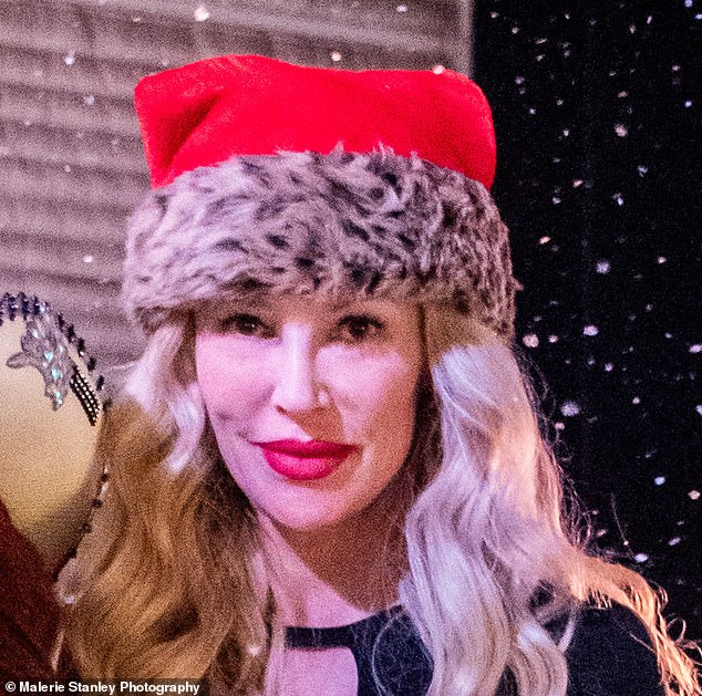 Brandi pictured at the event rocking the festive hat - perfect for the holiday season