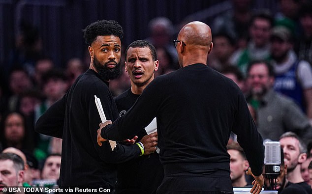 Joe Mazzulla is held back by assistant coach Sam Cassell (right) as he reacts to technical foul