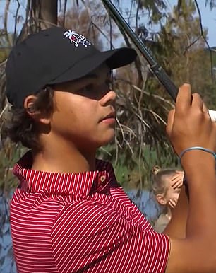 Charlie hits his shot on the fourth hole at the PNC Championship