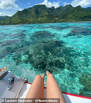 Lauren is pictured above in Mo¿orea, where 'jagged peaks rise like something only the creator of the universe could dream up'