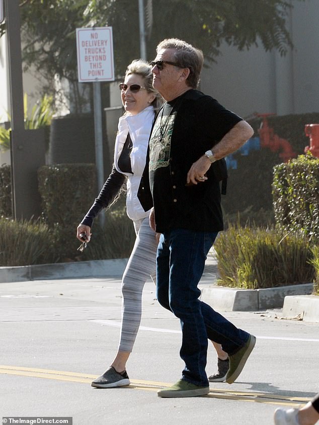 The actor, who is rarely seen in public, was pictured with a female companion doing some last minute Christmas shopping in Los Angeles on Monday