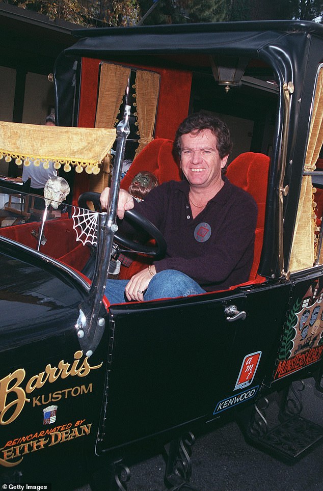 Patrick poses with the Munster Mobile at the Hollywood Collectors and Celebrity Show held at the Beverly Garland Holiday Inn in 2001, in North Hollywood, California