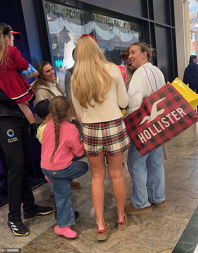 Molly-Mae, Tyson, 36, and Paris, 35, appeared to cross paths at the Trafford Centre in Greater Manchester on Monday, along with Molly-Mae's sister Zoe (right)