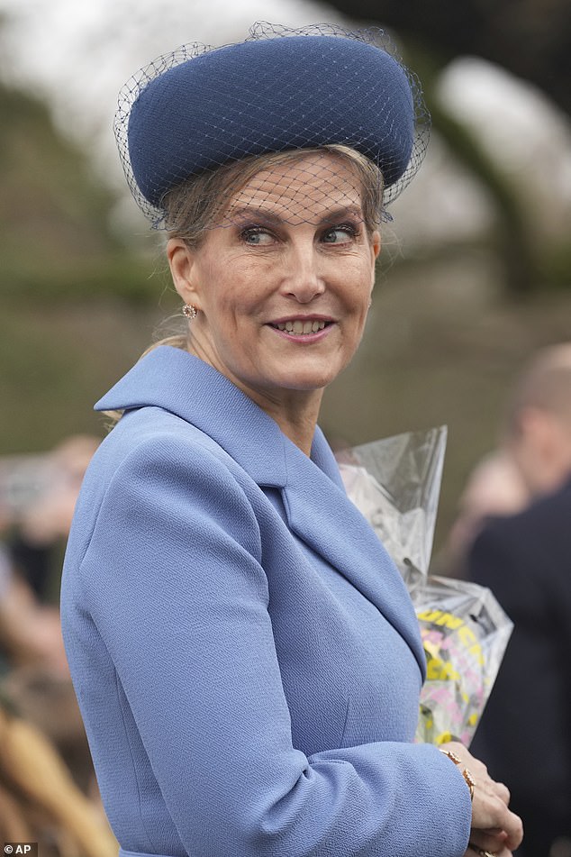 Sophie, Duchess of Edinburgh holds a bouquet of flowers gives by well-wishers after she attended the Christmas Day service