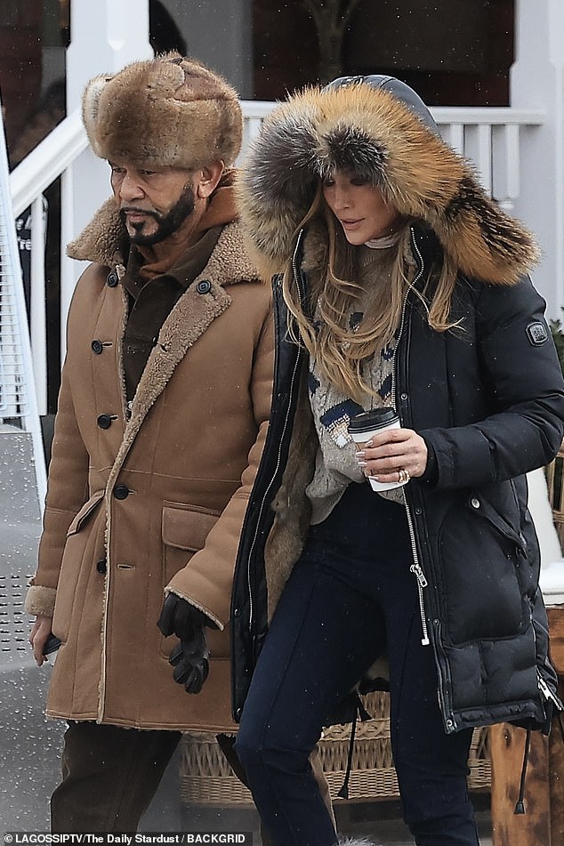 The brunette beauty appeared to stop for a warm drink to beat the freezing temperatures