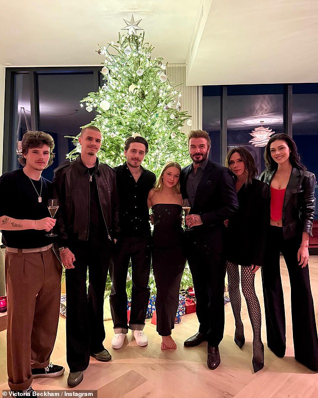 David and Victoria couldn't contain their smiles as they posed with all four of their children in a sweet family Instagram snap on Boxing Day